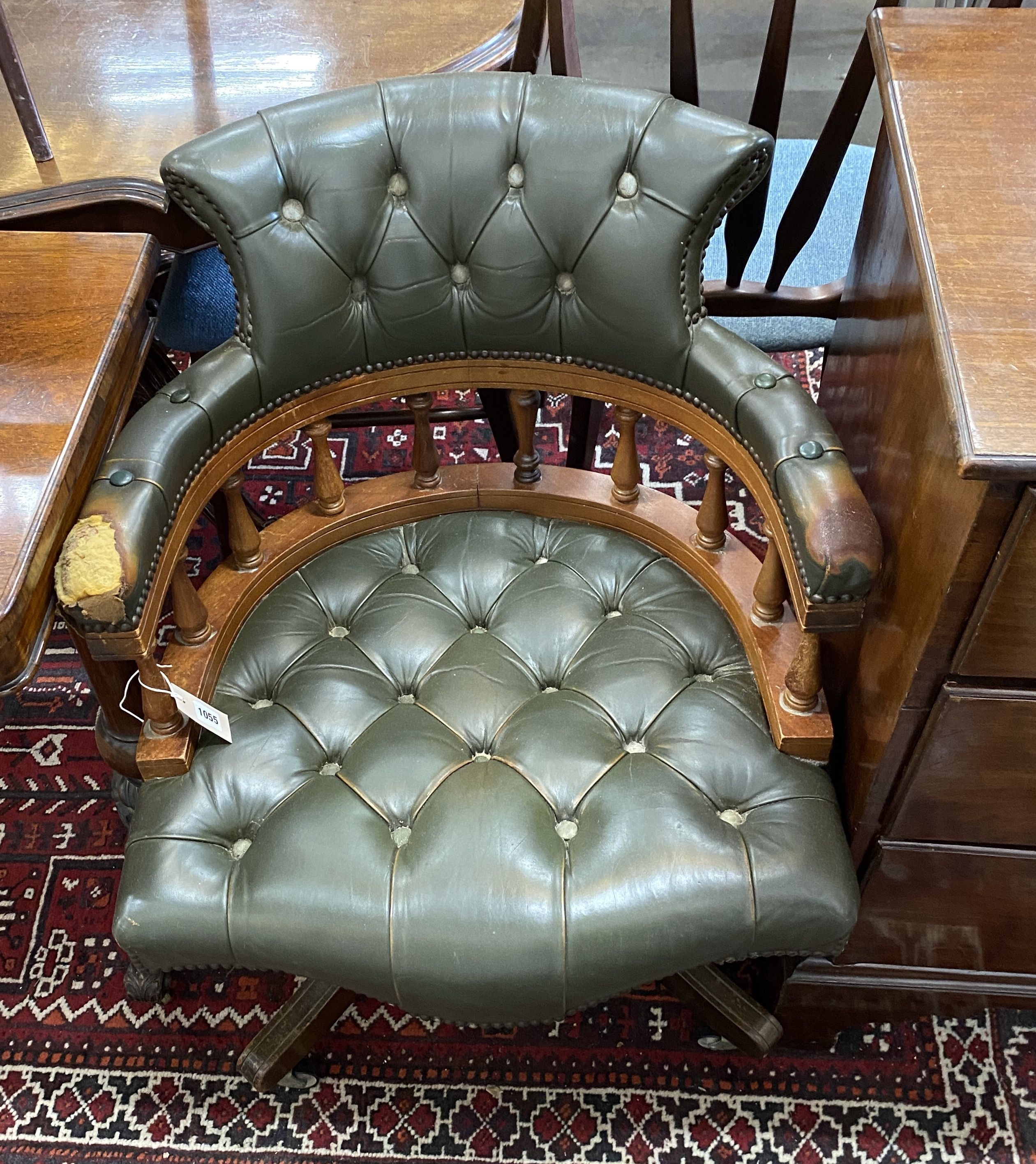 A Victorian style green leather, stained beech swivel desk chair, width 63cm, depth 57cm, height 80cm
